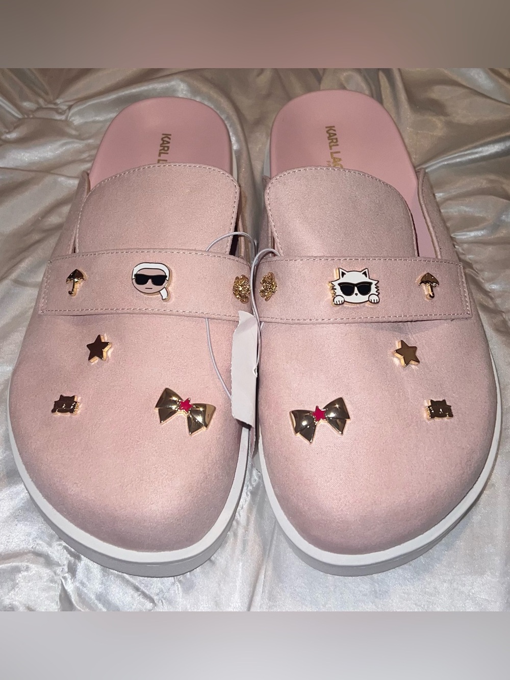 pink Karl Lagerfeld clogs featuring decorative charms